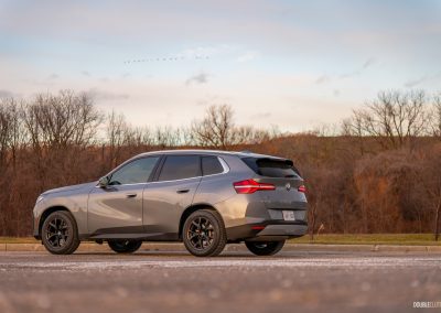 Rear three quarter view of the 2025 BMW X3 30 at sunset