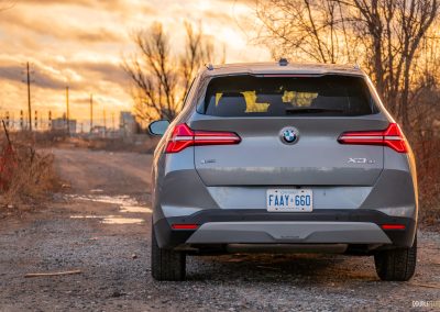 Rear view of the 2025 BMW X3 30 at sunset