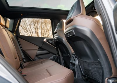 2025 BMW X3 30 interior view of rear seat in brown leather and panoramic moonroof