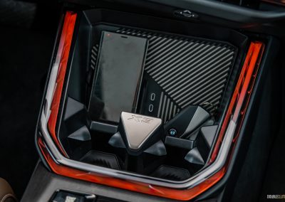 2025 BMW X3 30 interior detail of view central storage tray and wireless charging pad