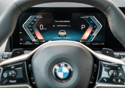 2025 BMW X3 30 interior detail view of digital gauge cluster and steering wheel