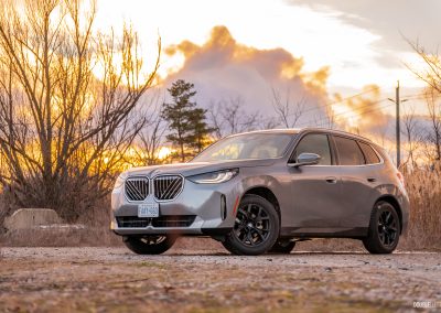 Front three quarter view of the 2025 BMW X3 30 at sunset