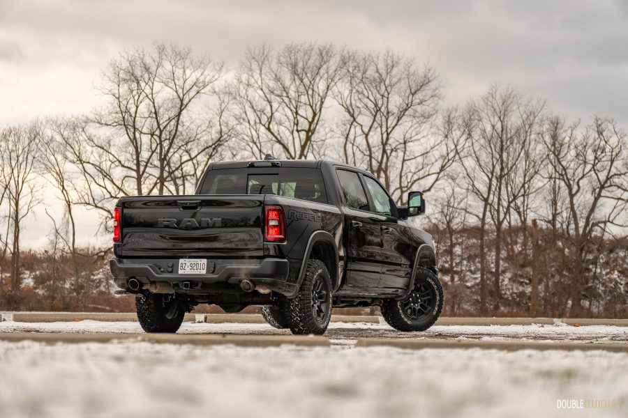 Black 2025 Ram 1500 Rebel rear three quarter view outdoors