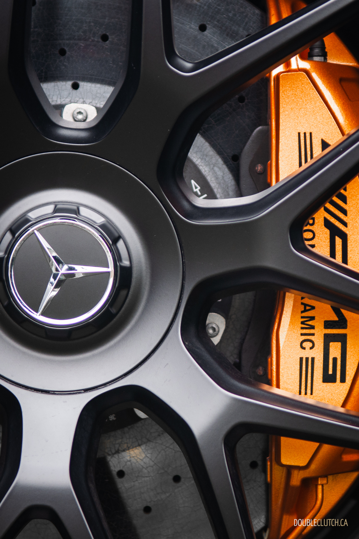 2025 Mercedes-AMG GT 63 S E-Performance 4-Door Coupe close up detail view of multispoke wheel with gold AMG brake caliper