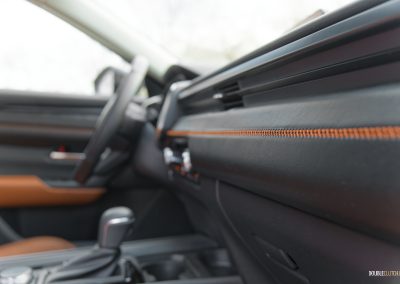 Close-up detail showing the very nice stitching in a 2025 Mazda CX-50 Hybrid