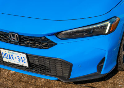 Close-up view of the restyled front fascia on a 2025 Honda Civic Hybrid Hatchback