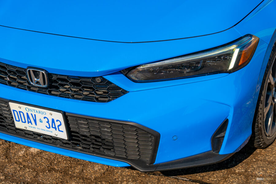 Close-up view of the restyled front fascia on a 2025 Honda Civic Hybrid Hatchback