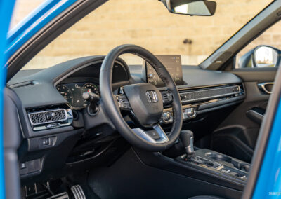 Interior view showing the cockpit area of the 2025 Honda Civic Hybrid Hatchback