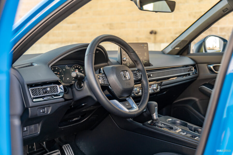 Interior view showing the cockpit area of the 2025 Honda Civic Hybrid Hatchback