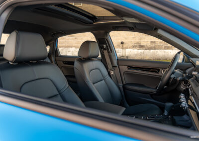 Interior view showing the front seat area of the 2025 Honda Civic Hybrid Hatchback