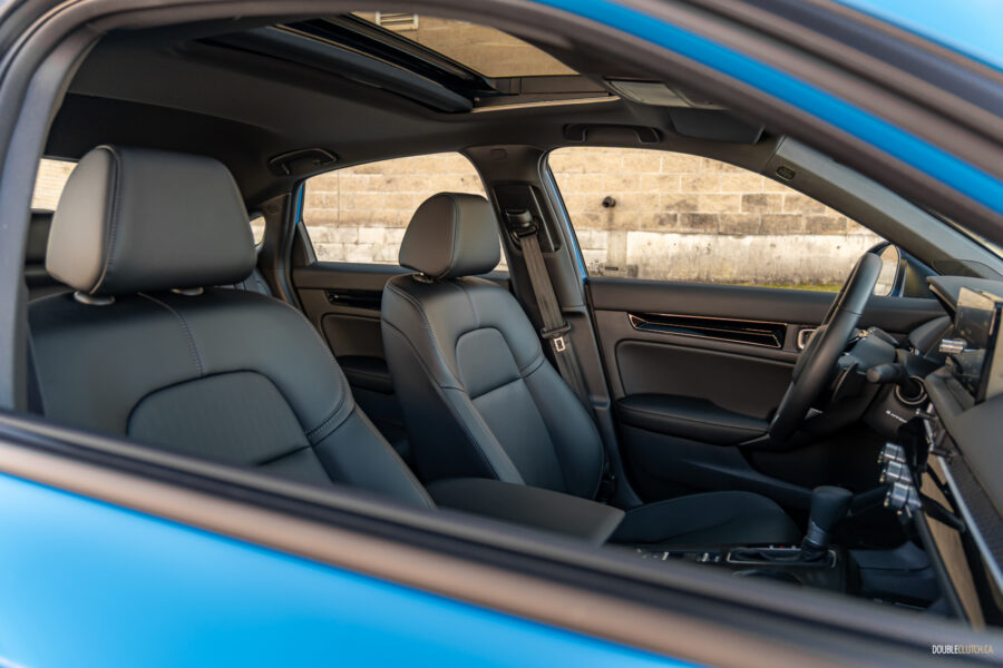 Interior view showing the front seat area of the 2025 Honda Civic Hybrid Hatchback