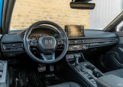 Interior view showing the cockpit area of the 2025 Honda Civic Hybrid Hatchback