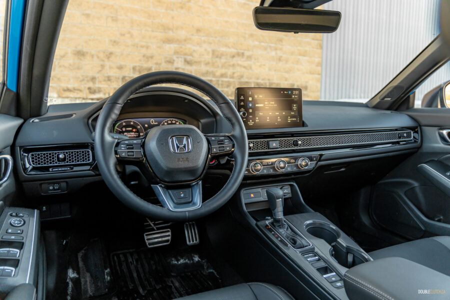 Interior view showing the cockpit area of the 2025 Honda Civic Hybrid Hatchback