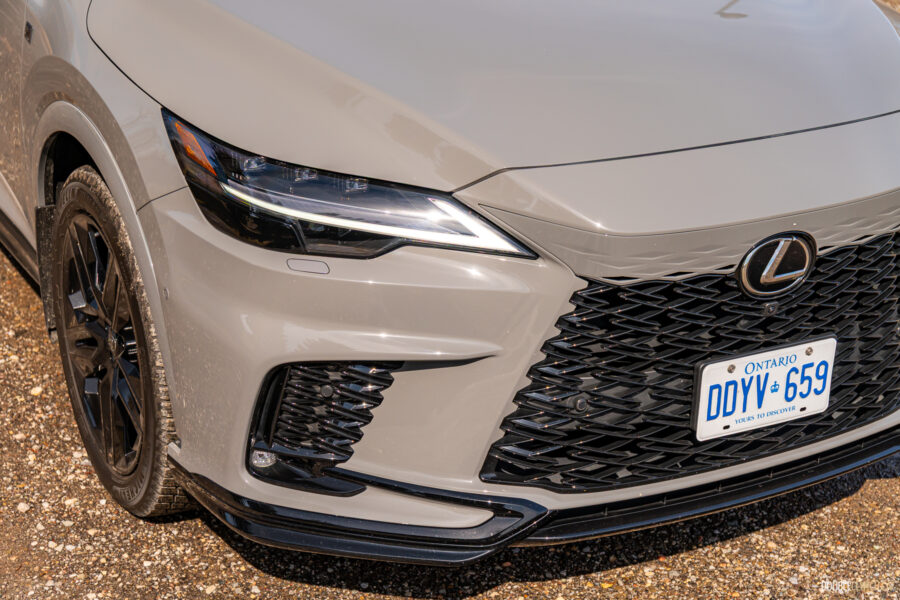Close-up view of the front headlight and grille design on a grey 2025 Lexus RX 500h Black Line Special Edition