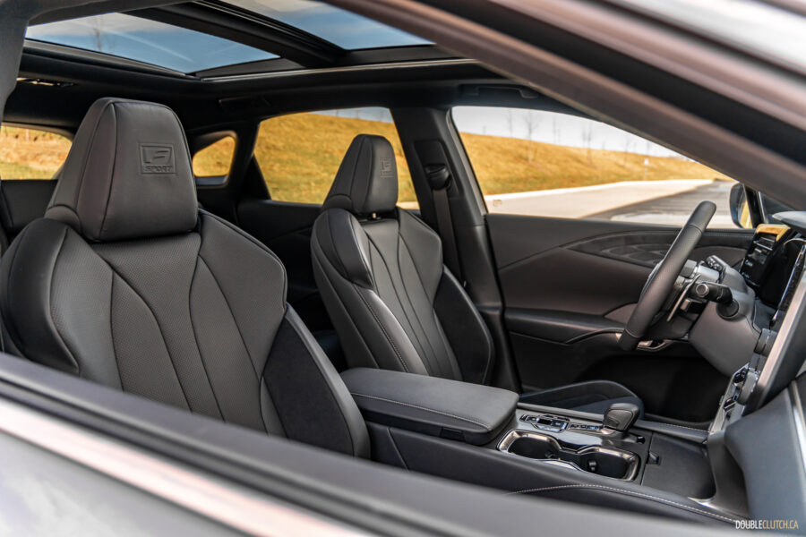 Interior view of the front seats and panoramic sunroof in a 2025 Lexus RX 500h Black Line Special Edition
