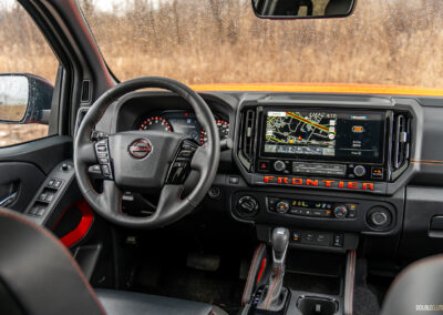 Interior view showing the driver-side cockpit in a 2025 Nissan Frontier PRO-4X Luxury