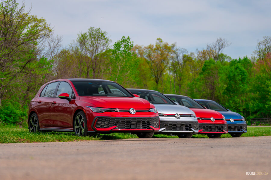2025 Volkswagen Golf GTI lined up in a row at a racetrack