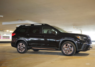 Front quarter view of a black 2025 Subaru Ascent parked in a parking garage