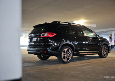 Rear quarter view of a black 2025 Subaru Ascent parked in a parking garage