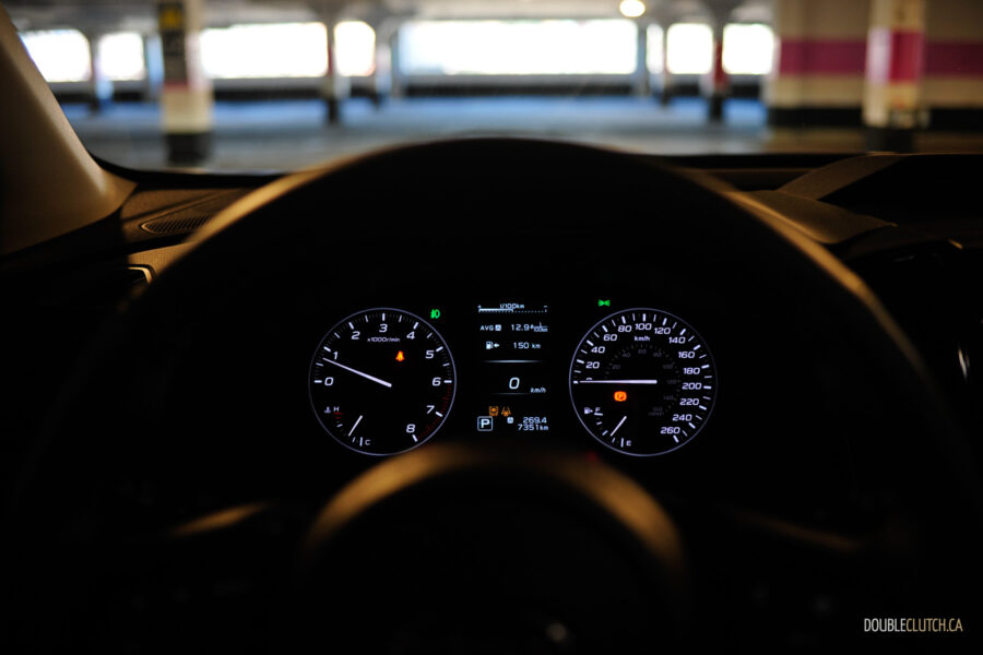 Interior view showing the gauge cluser of a 2025 Subaru Ascent in a dark environment