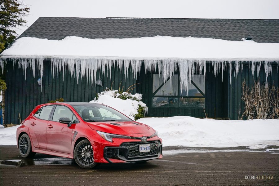 2025 Toyota GR Corolla front quarter view with a building and big icicles in the background