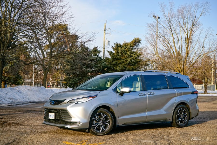 Front quarter view of a 2025 Toyota Sienna against a backdrop of trees