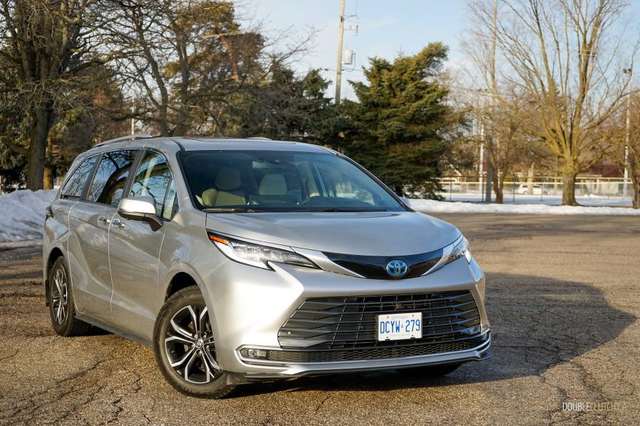 Front quarter view of a 2025 Toyota Sienna against a backdrop of trees