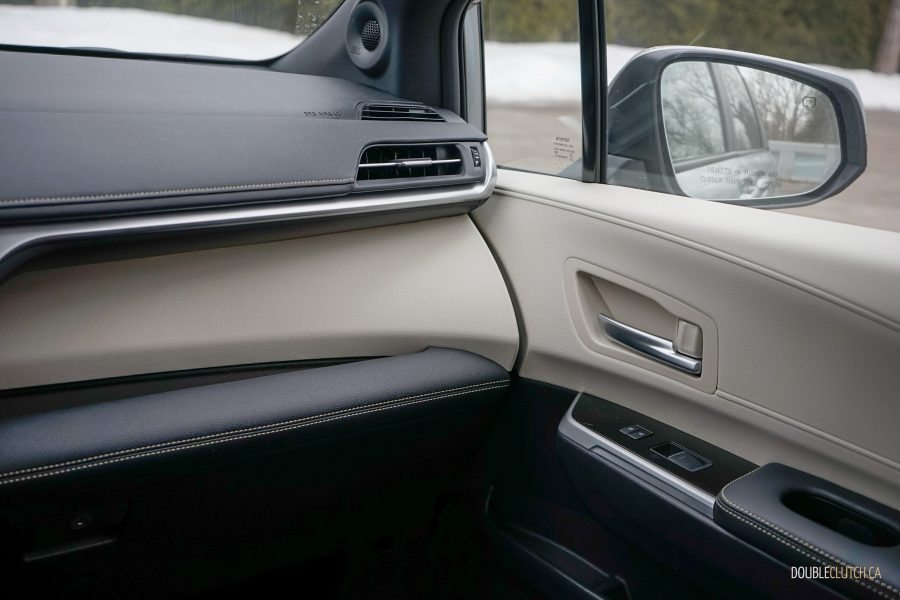 Interior view of the passenger-side dashboard and door panel inside a 2025 Toyota Sienna