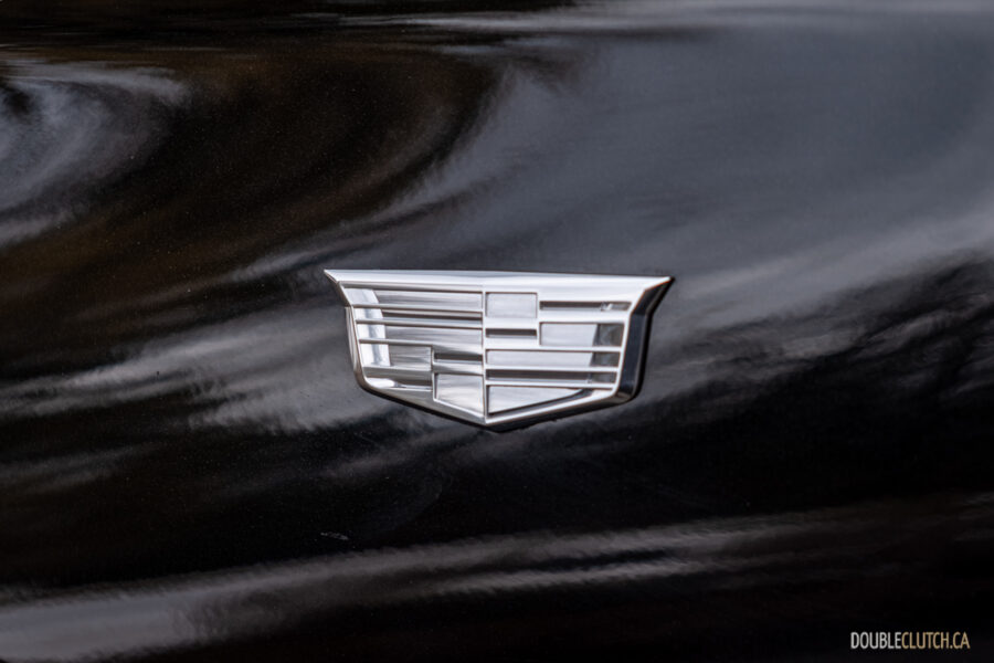 Close-up of the monochrome fender badge on a 2025 Cadillac XT6