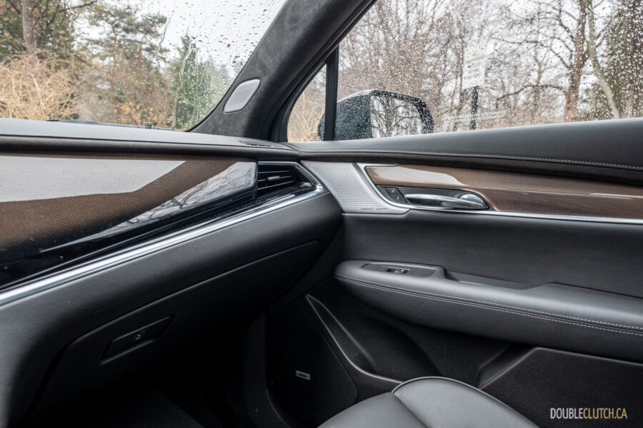 Interior view of the passenger-side dash, door design, and trim in a 2025 Cadillac XT6