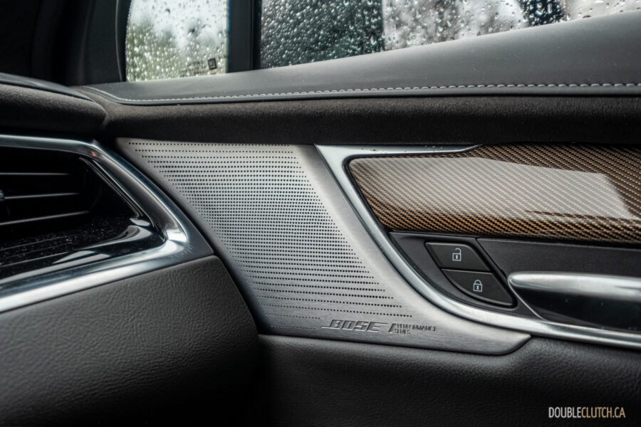Close-up of the metallic speaker grilles in a 2025 Cadillac XT6