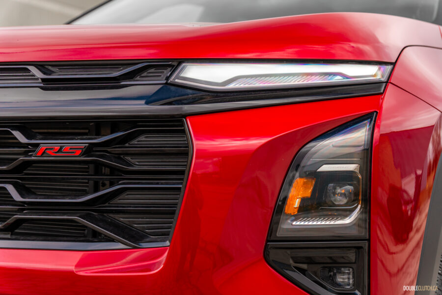 Close-up view of the redesigned front fascia on a red 2025 Chevrolet Equinox