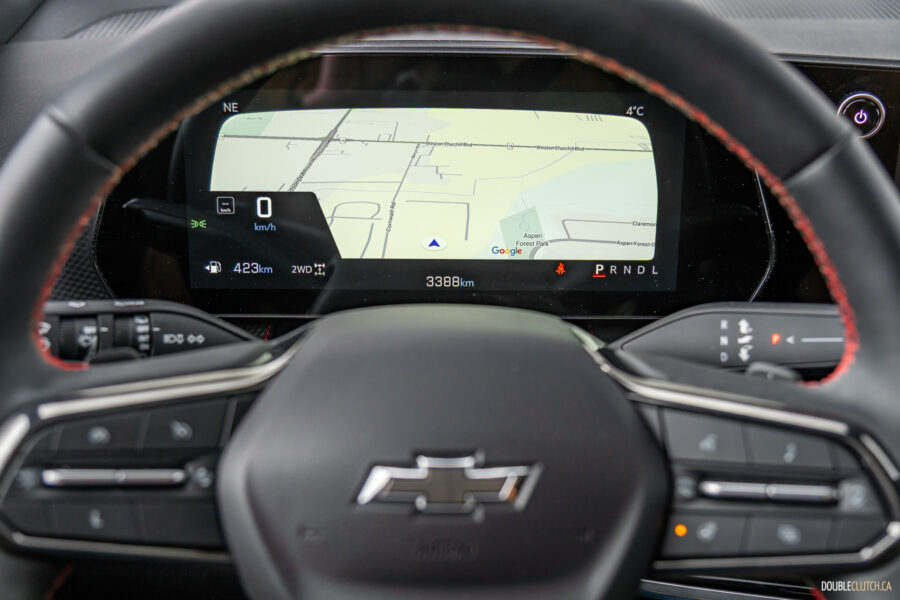 Interior close-up showing the digital gauge cluster and steering wheel in a 2025 Chevrolet Equinox