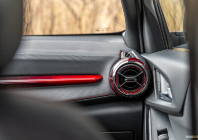 Interior view showing the dashboard design and red trim in a 2025 Chevrolet Equinox