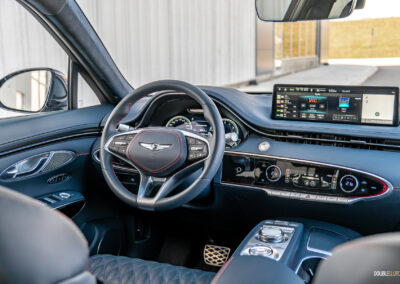 Interior view showing the driver cockpit area in a 2025 Genesis GV70 3.5T Sport Plus