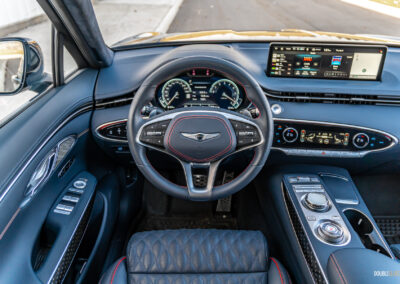 Interior view showing the driver cockpit area in a 2025 Genesis GV70 3.5T Sport Plus