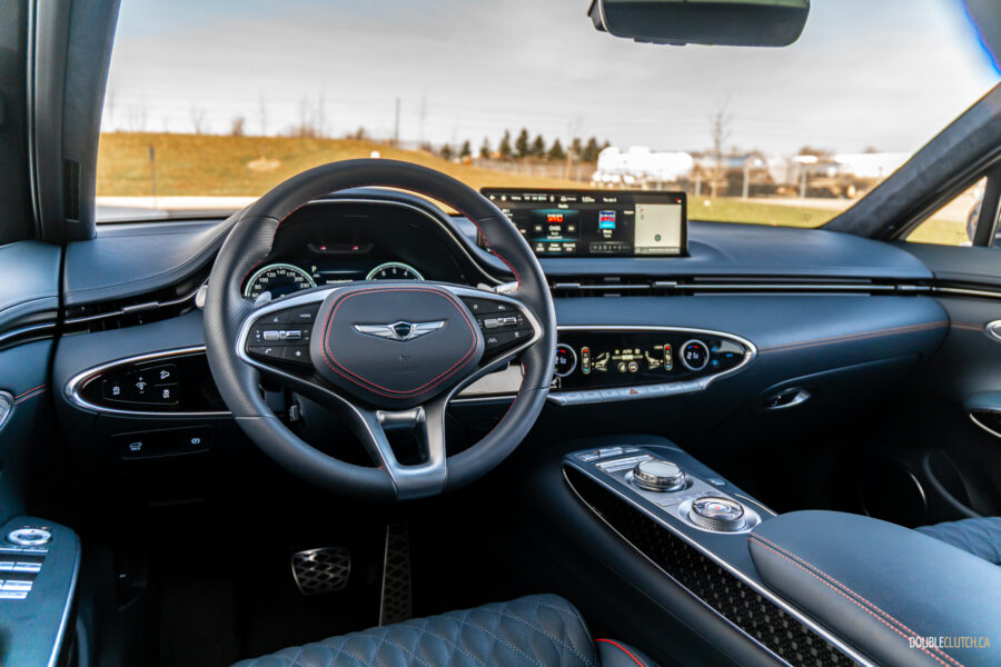 Interior view showing the dashboard design and layout in a 2025 Genesis GV70 3.5T Sport Plus