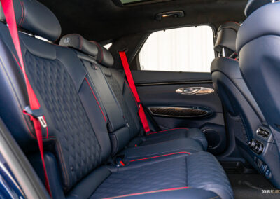 Interior view showing the rear-seat area in a 2025 Genesis GV70 3.5T Sport Plus