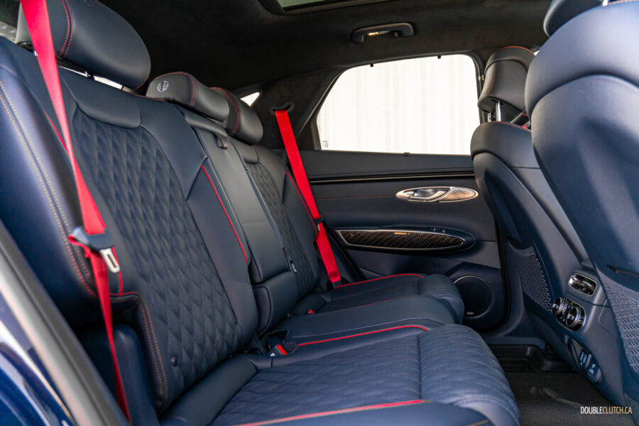 Interior view showing the rear-seat area in a 2025 Genesis GV70 3.5T Sport Plus