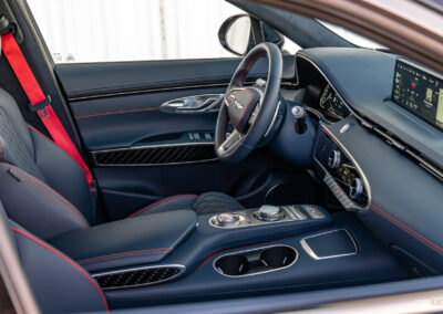 Interior view showing the driver cockpit area in a 2025 Genesis GV70 3.5T Sport Plus