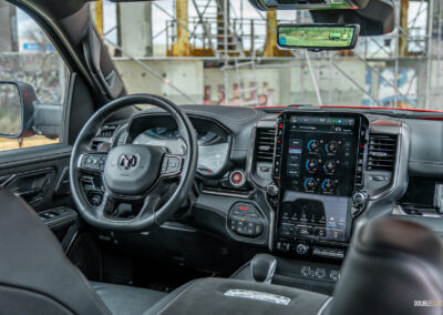 Interior view showing the dashboard design and interior layout in a 2025 Ram 1500 RHO