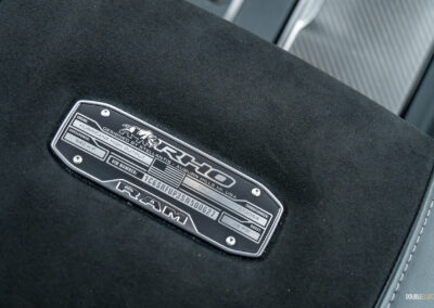 Close-up showing the armrest plaque in a 2025 Ram 1500 RHO