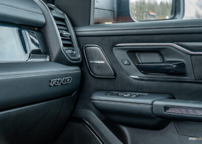 Interior view showing the passenger-side door panel design in a 2025 Ram 1500 RHO