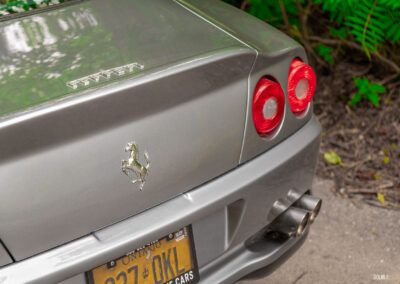 Close-up view of the rear end of a grey 1996 Ferrari 550 Maranello