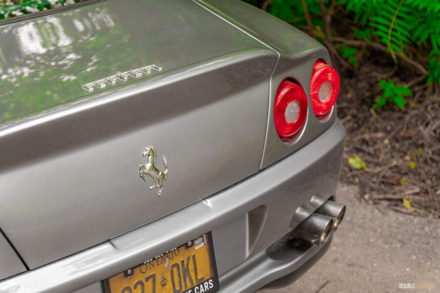 Close-up view of the rear end of a grey 1996 Ferrari 550 Maranello