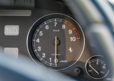 Close-up of the tachometer and oil pressure gauge in a 1996 Ferrari 550 Maranello