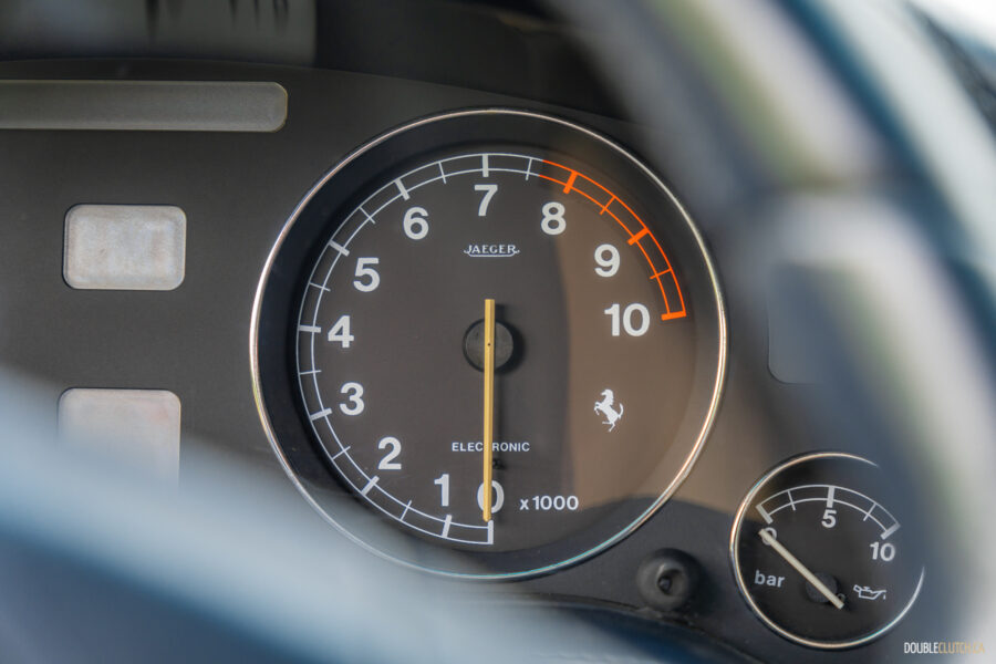 Close-up of the tachometer and oil pressure gauge in a 1996 Ferrari 550 Maranello