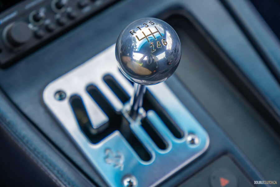 Close-up of the gated shift mechanism in a 1996 Ferrari 550 Maranello