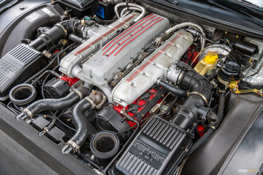 The iconic V12 engine under the hood of a 1996 Ferrari 550 Maranello