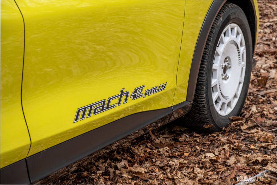 Close-up showing the door graphics on a yellow 2025 Ford Mustang Mach-E Rally